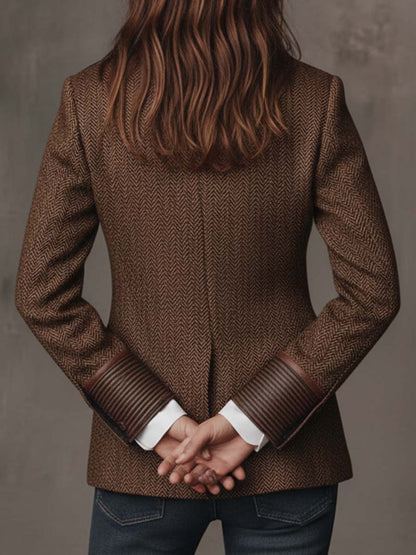 Blazer de mujer de espiga con paneles estampados.